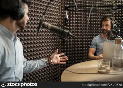 close up men discussing radio