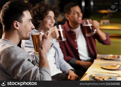 close up men drinking beer