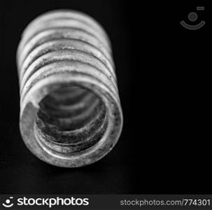 close up metal spring on black background