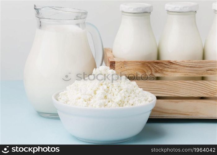 close up milk jug with fresh cottage cheese. High resolution photo. close up milk jug with fresh cottage cheese. High quality photo