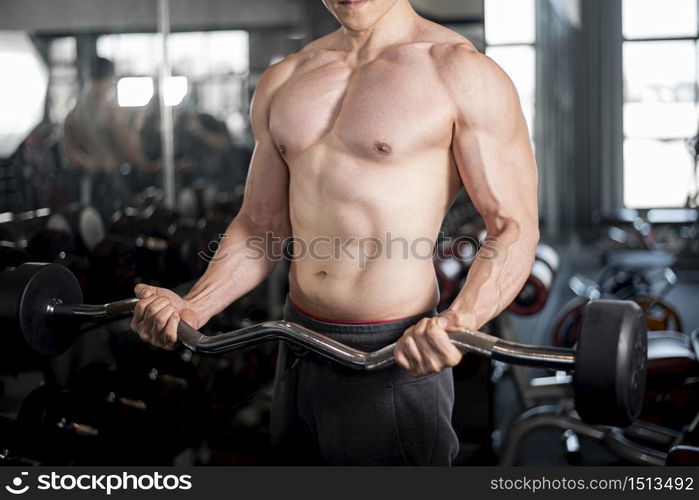 Close up muscular man is exercise in fitness gym