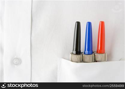 Close Up Of 3 Pens Neatly Sitting In A Mans White Shirt Pocket