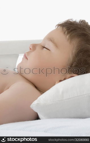 Close-up of a baby boy sleeping in a crib