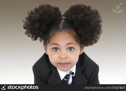 Close-up of a beautiful Little Business Woman In Jacket And Tie. Huge hazel eyes.