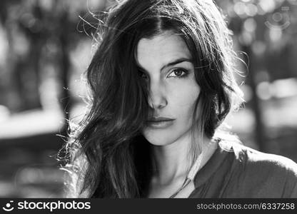 Close-up of a beautiful woman in a urban park