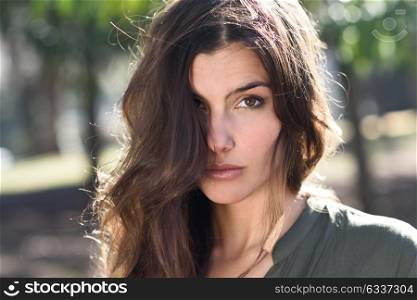 Close-up of a beautiful woman in a urban park