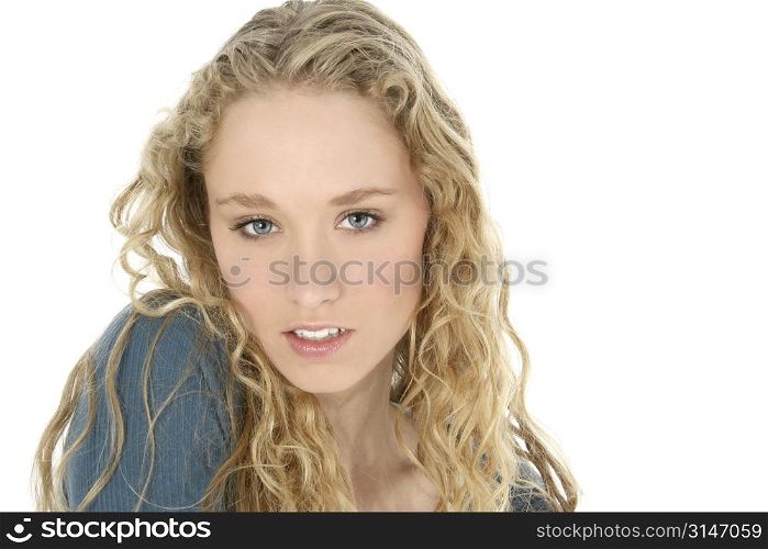 Close up of a beautiful young woman with long curly blonde hair and blue eyes.