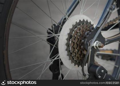 Close up of a Bicycle wheel with details, chain and gearshift mechanism