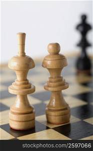 Close-up of a Bishop and a Queen on a chessboard