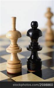 Close-up of a Bishop and a Queen on a chessboard