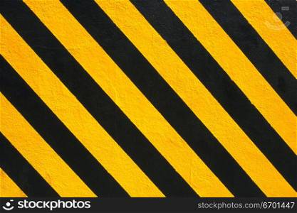 Close-up of a black and yellow striped surface