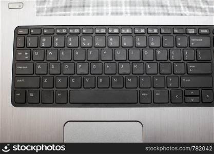 Close up of a black keyboard of a modern laptop. technology. Close up of a black keyboard of a modern laptop.