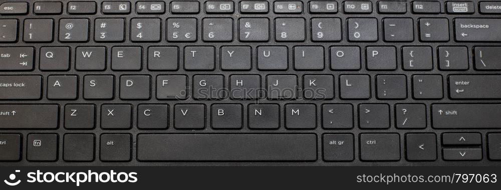 Close up of a black keyboard of a modern laptop. technology. Close up of a black keyboard of a modern laptop.