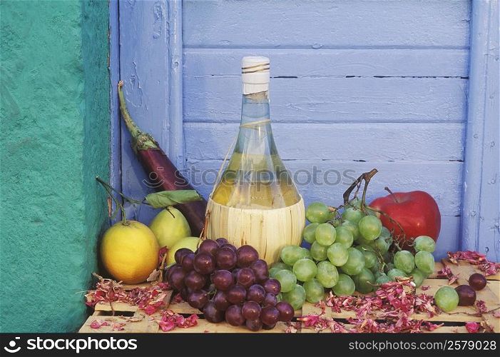 Close-up of a bottle with assorted fruits