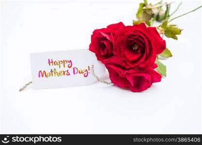 Close up of a bouquet of pink roses with a happy mothers day card on a white background