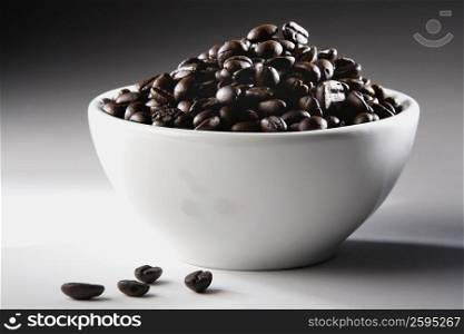 Close-up of a bowl full of coffee beans