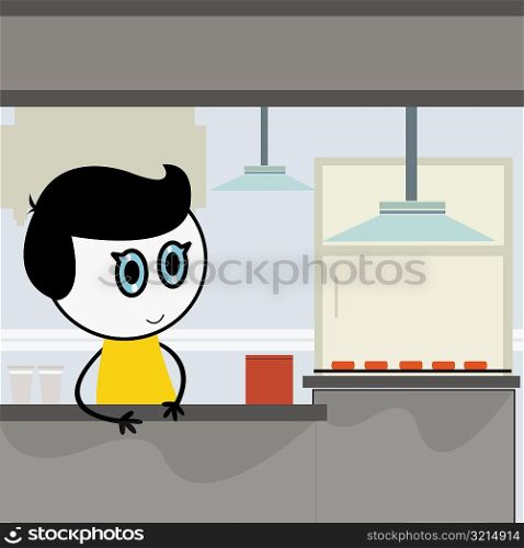 Close-up of a boy at a kitchen counter