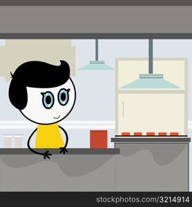 Close-up of a boy at a kitchen counter