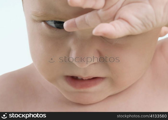 Close-up of a boy crying