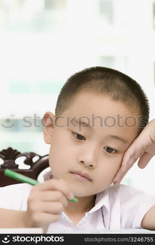 Close-up of a boy doing his homework