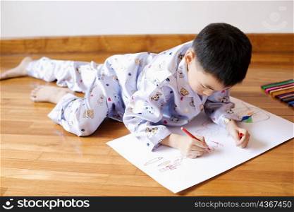 Close-up of a boy drawing on paper