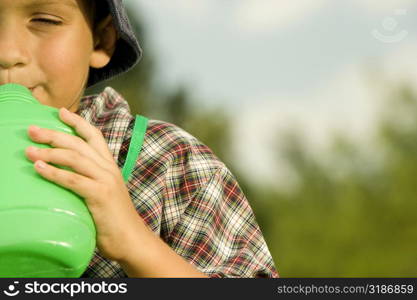 Close-up of a boy drinking water