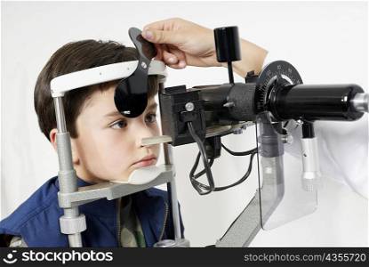 Close-up of a boy having an eye exam