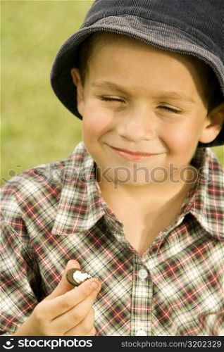 Close-up of a boy holding a chocolate