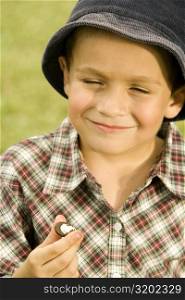 Close-up of a boy holding a chocolate