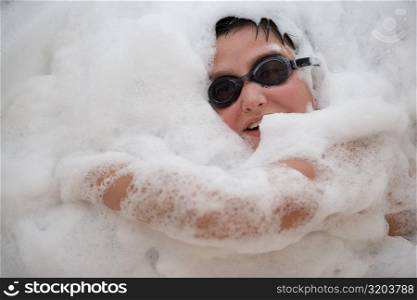 Close-up of a boy in a bubble bath