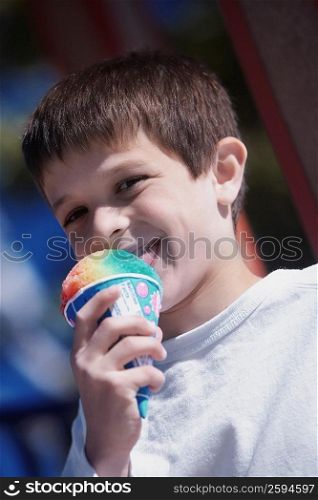 Close-up of a boy licking an ice-cream