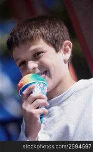 Close-up of a boy licking an ice-cream