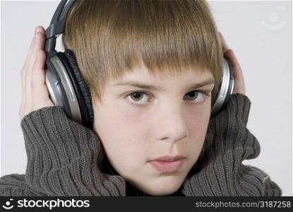 Close-up of a boy listening to music