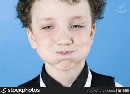 Close-up of a boy making a face