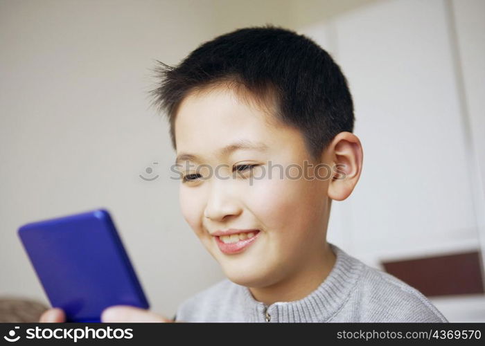 Close-up of a boy playing a video game