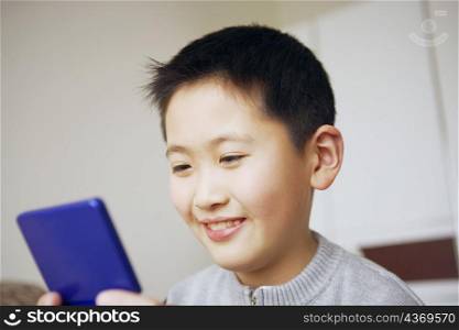 Close-up of a boy playing a video game