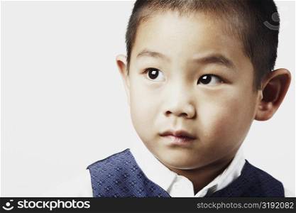 Close-up of a boy posing and looking away