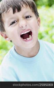Close-up of a boy shouting while eating