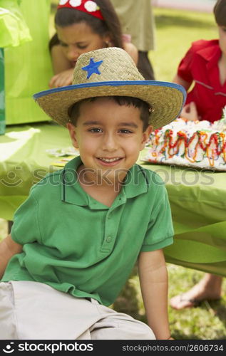 Close-up of a boy smiling at a birthday party