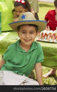 Close-up of a boy smiling at a birthday party