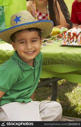 Close-up of a boy smiling at a birthday party