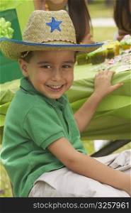 Close-up of a boy smiling at a birthday party