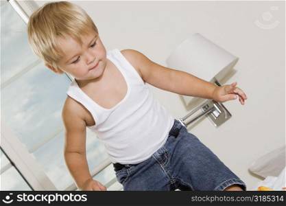 Close-up of a boy standing on the bed