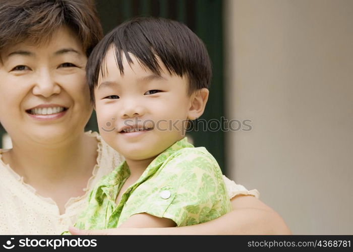 Close-up of a boy with his grandmother