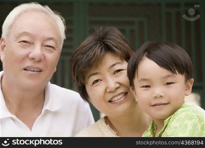 Close-up of a boy with his grandparents