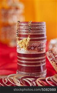 Close-up of a bridal chuda and mangal sutra