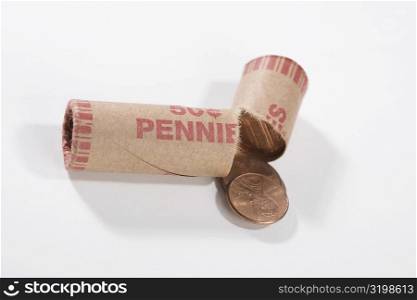 Close-up of a broken coin roll of pennies