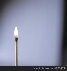 Close-up of a burning matchstick