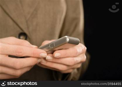 Close-up of a business person&acute;s hand text messaging
