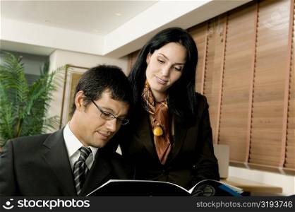 Close-up of a businessman and a businesswoman in an office